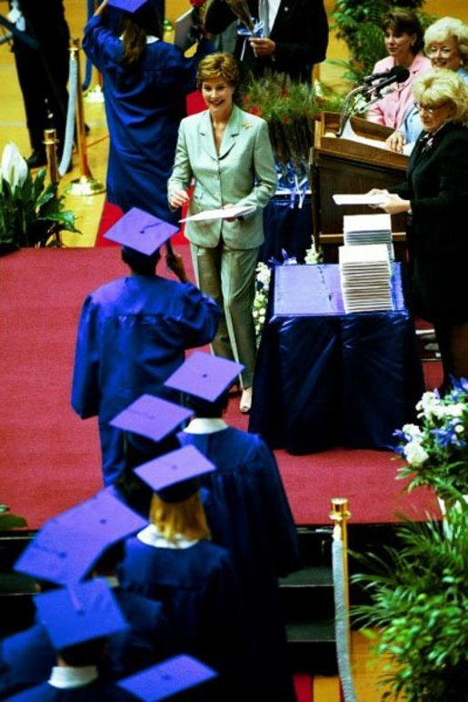 Mrs. Bush awards diplomas at the Fort Campbell High School Graduation at the Dunn Center at the Austin Peay State University in Fort Campbell, Ky., May 23, 2003. White House photo by Tina Hager
