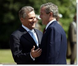 President George W. Bush and President of Poland Aleksander Kwasniewski talk during the President's trip to the Wawel Royal Palace in Krakow, Poland, Saturday, May 31, 2003.  White House photo by Paul Morse