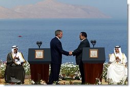 President George W. Bush and President Hosni Mubarak of Egypt after delivering statements on the progress of the Red Sea Summit in Sharm El Sheikh, Egypt June 3, 2003. On the far left sits Prince Abdullah Bin Abd Al Aziz of Saudi Arabia and on the far right sits King Hamad Bin Issa Al Khalifa of Bahrain.  White House photo by Paul Morse