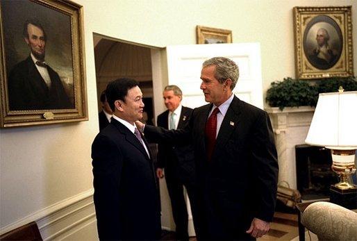 President George W. Bush meets with the Prime Minister Thaksin Shinawatra of Thailand in the Oval Office Tuesday, June 10, 2003. White House photo by Eric Draper