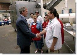 President George W. Bush greets employees of Andrea Foods in Orange, N.J., Monday, June 16, 2003.  White House photo by Eric Draper