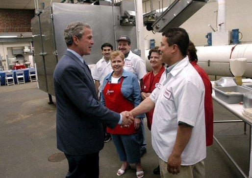 President George W. Bush greets employees of Andrea Foods in Orange, N.J., Monday, June 16, 2003. White House photo by Eric Draper