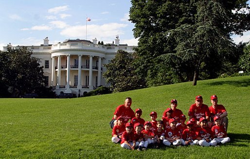 The Fort Belvoir Little League Braves of Fort Belvoir, Va., pose for a team photo after playing tee ball with the Naval Base LIttle League Yankees of Norfolk, Va., on the South Lawn Sunday, June 22, 2003. White House photo by Lynden Steele.