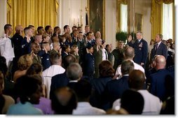 Marking the 30th anniversary of the All-Volunteer Force that constitutes America's military, President George W. Bush watches as Chairman of the Joint Chiefs of Staff General Richard Myers conducts a reenlistment service in the East Room Tuesday, July 1, 2003.  White House photo by Eric Draper