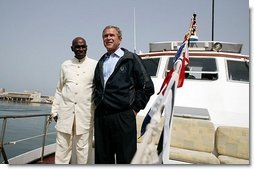 President George W. Bush and President Abdoulaye Wade of Senegal ride aboard the Presidential Yacht to Goree Island, Senegal, Tuesday, July 8, 2003.  White House photo by Paul Morse