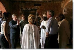 President George W. Bush and Laura Bush tour the Slave House on Goree Island, Senegal, with President Abdoulaye Wade and Viviane Wade of Senegal, Secretary of State Colin Powell, far left, and National Security Advisor Dr. Condoleezza Rice Tuesday, July 8, 2003.  White House photo by Paul Morse