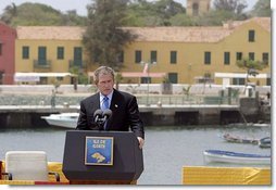 President George W. Bush delivers remarks after touring Goree Island, Senegal, Tuesday, July 8, 2003. "For hundreds of years on this island peoples of different continents met in fear and cruelty. Today we gather in respect and friendship, mindful of past wrongs and dedicated to the advance of human liberty," said the President.  White House photo by Paul Morse