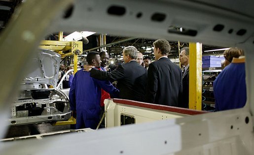President George W. Bush meets one-on-one with workers at the Ford Motor Company plant near Pretoria, South Africa, Wednesday, July 9, 2003. White House photo by Paul Morse