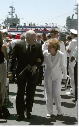 Vice President Dick Cheney talks with former First Lady Nancy Reagan after the commissioning ceremony for the USS Ronald Reagan in Norfolk, Va., July 12, 2003. "As we think this afternoon of our 40th President, we think also of the devoted wife at his side," Vice President Cheney said during the ceremony. "Mrs. Reagan, our nation is so grateful to you. You've shared in your husband's great life. And today, you share in the pride of this tribute from the people of the United States of America."   White House photo by David Bohrer