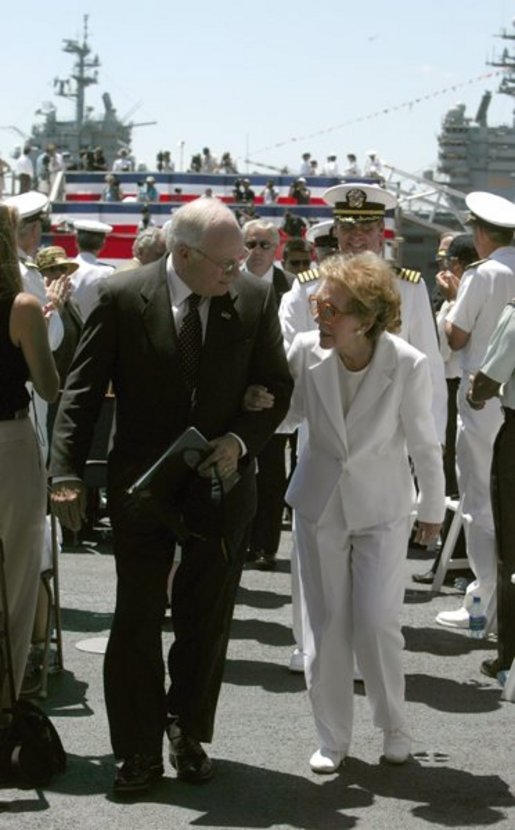 Vice President Dick Cheney talks with former First Lady Nancy Reagan after the commissioning ceremony for the USS Ronald Reagan in Norfolk, Va., July 12, 2003. "As we think this afternoon of our 40th President, we think also of the devoted wife at his side," Vice President Cheney said during the ceremony. "Mrs. Reagan, our nation is so grateful to you. You've shared in your husband's great life. And today, you share in the pride of this tribute from the people of the United States of America."  White House photo by David Bohrer.