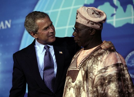 President George W. Bush with Nigerian President Olesugun Obasanjo after speaking at the Leon H. Sullivan Summit in Abuja, Nigeria on July 12, 2003. White House photo by Paul Morse.