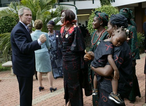President George W. Bush talks with women who are members of Women and Children of Hope and the Nigerian Community of Western Living with AIDS at National Hospital in Abuja, Nigeria on July 12, 2003. White House photo by Paul Morse.