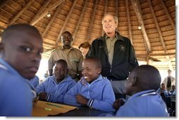 President George W. Bush talks to students attending nature classes at the Mokolodi Nature Reserve near Gaborone, Botswana Thursday, July 10, 2003.  White House photo by Paul Morse