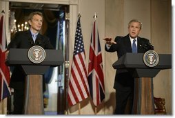  President George W. Bush speaks during a news conference with British Prime Minister Tony Blair in the Cross Hall of the White House, Thursday, July 17, 2003  White House photo by Paul Morse