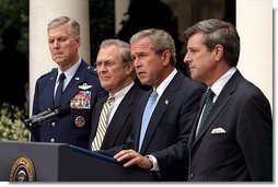 Listing recent achievements reached in Iraq, President George W. Bush holds a press conference in the Rose Garden, Wednesday, July 23, 2003. Standing with the President are Chairman of the Joint Chiefs of Staff General Richard Myers, Secretary of Defense Donald Rumsfeld and Presidential Envoy to Iraq Ambassador Paul Bremer.  White House photo by Paul Morse