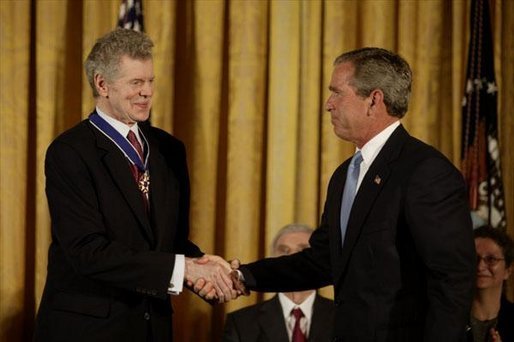 President George W. Bush presents the Presidential Medal of Freedom to Van Cliburn during a ceremony in the East Room Wednesday, July 23, 2003. Mr. Cliburn is a concert pianist whose talents have inspired countless artists. White House photo by Paul Morse