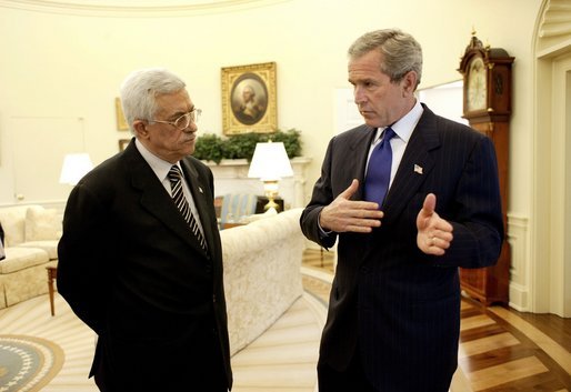 President George W. Bush and Palestinian Prime Minister Mahmoud Abbas meet in the Oval Office Friday, July 25, 2003. Meeting for the first time at the White House, the two leaders also held a working lunch and a joint press conference in the Rose Garden. White House photo by Eric Draper.