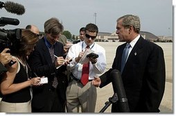 President George W. Bush discusses the death of entertainer with the press Bob Hope as he boards Air Force One July 28, 2003. "Today America lost a great citizen. We mourn the passing of Bob Hope. Bob Hope made us laugh, and he lifted our spirits. Bob Hope served our nation when he went to battlefields to entertain thousands of troops from different generations," said the President.  White House photo by Paul Morse