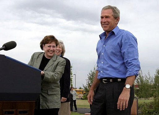 President George W. Bush is introduced by Secretary of Agriculture Ann Veneman before discussing his healthy forest initiative in Redmond, Ore., Thursday, August 21, 2003. Secretary of the interior Gale Norton is pictured in the background. White House photo by Paul Morse.