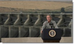 President George W. Bush discusses salmon restoration from Ice Harbor Locks and Dam in Burbank, Wash., Friday, August 22, 2003. "I was pleased to see the incredible care that goes in to protecting the salmon that journey up the river. It's an important message to send to people, it seems like to me, that a flourishing salmon population is a vital part of the vibrancy of this incredibly beautiful part of our country," said the President in his remarks about his tour of the facility.  White House photo by Paul Morse