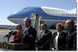 President George W. Bush talks with the media after stopping in Seattle, Wash., Friday, August 22, 2003. President Bush discussed a range of issues including his tax plan, the fires in Oregon, Iraq, and the Middle East.  White House photo by Paul Morse