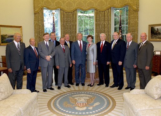 President George W. Bush stands with Mississippi legislators who switched from the Democratic Party to the Republican Party in the Oval Office Tuesday, Sept. 2, 2003. White House photo by Tina Hager.