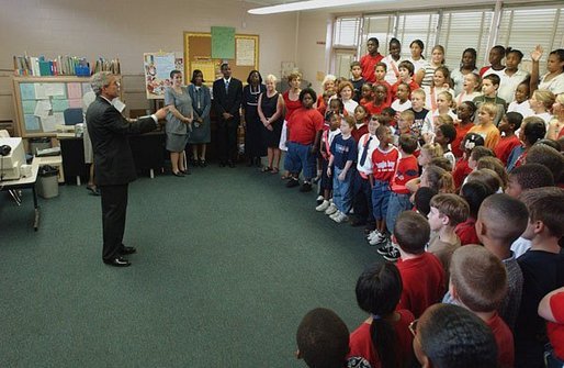 President George W. Bush is greeted by students at Hyde Park Elementary School in Jacksonville, Fla., Tuesday, Sept. 9, 2003. White House photo by Tina Hager