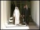 President George W. Bush and Prime Minister Sheikh Sabah al Ahmad al-Jabir Al Sabah of Kuwait walk along the colonnade after the two leaders met with reporters in the Oval Office Wednesday, Sept. 10, 2003.  White House photo by Paul Morse
