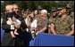 President George W. Bush holds 7-month-old Frank Antonelli, whose father is a major in the Marine corps, as he greets workers at the FBI Academy in Quantico, Va., Wednesday, Sept. 10, 2003. White House photo by Paul Morse