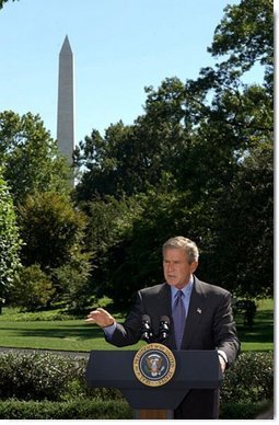 President George W. Bush discusses his Clear Skies Initiative in the East Garden Tuesday, Sept. 16, 2003. The initiative mandates a 70 percent cut in air pollution from power plants over the next 15 years, including the first-ever national cap on mercury emissions.  White House photo by Tina Hager