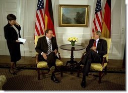 President George W. Bush talks with German Chancellor Gerhard Schroeder during a series of United Nations meetings with world leaders in New York Wednesday, Sept. 24, 2003. After the meeting, the two leaders addressed the media. "We're both committed to freedom; we're both committed to peace; we're both committed to the prosperity of our people," said President Bush.  White House photo by Paul Morse