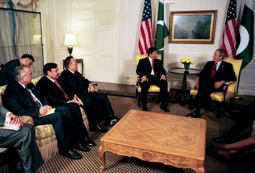 President George W. Bush talks with President Pervez Musharraf of Pakistan during a series of United Nations meetings with world leaders in New York Wednesday, Sept. 24, 2003. White House photo by Paul Morse.