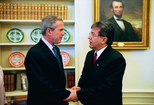 President George W. Bush and President Nicanor Duarte of Paraguay talk in the Oval Office Friday, Sept. 26, 2003. White House photo by Tina Hager