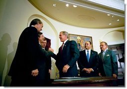 President George W. Bush signs the Do Not Call Registry in the Roosevelt Room Sept. 29, 2003. Pictured with the President are, from left, Rep. Edward Markey, D-Mass.; Rep. Fred Upton, R-Mich.; Federal Trade Commission Chairman Timothy Muris; Rep. Billy Tauzin, R-La. (behind President Bush); Federal Communications Commission Chairman Michael Powell; and Sen. Ted Stevens, R-Alaska.  White House photo by Eric Draper