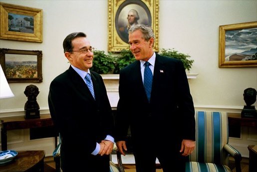 President George W. Bush hosts a visit by Colombian President Alvaro Uribe to the Oval Office Wednesday, Oct. 1, 2003. White House photo by Eric Draper.