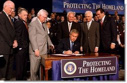 President George W. Bush signs the Homeland Security Appropriations Act of 2004 at the Department of Homeland Security in Washington, D.C., Wednesday, Oct. 1, 2003. "The Homeland Security bill I will sign today commits $31 billion to securing our nation, over $14 billion more than pre-September 11th levels. The bill increases funding for the key responsibilities at the Department of Homeland Security and supports important new initiatives across the Department," said the President in his remarks.  White House photo by Tina Hager