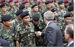 President George W. Bush greets Thai troops after his remarks at the Royal Thai Army Headquarters in Bangkok, Thailand, Sunday, Oct. 19, 2003.  White House photo by Paul Morse