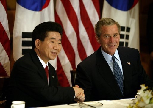 President George W. Bush and South Korean President Roh Moo-Hyun meet for a working breakfast in Bangkok, Thailand, Oct. 20, 2003. White House photo by Paul Morse.