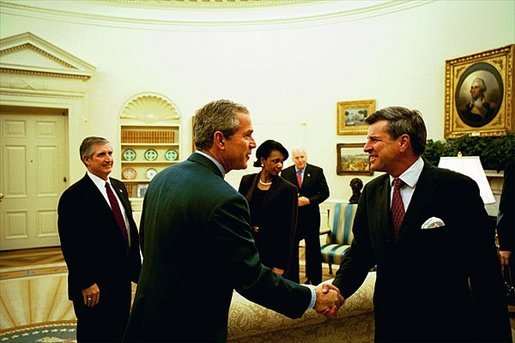 Discussing the progress in Iraq, President George W. Bush meets with Ambassador L. Paul Bremer, Presidential Envoy to Iraq, in the Oval Office Monday, Oct. 27, 2003. "Well, a lot of wonderful things have happened in Iraq since July, as you mentioned," said Ambassador Bremer to the media. "We have a cabinet now, with ministers actually conducting affairs of state. We have met all of our goals in restoring essential services. All the schools and hospitals are open. Electricity is back at pre-war levels." White House photo by Tina Hager.