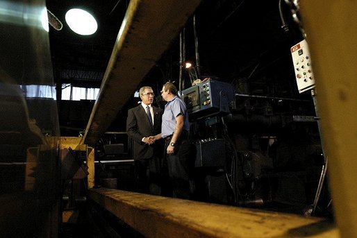 President George W. Bush greets employee Bill Haines during a tour of the Central Aluminum Company in Columbus, Ohio, Thursday, Oct. 30, 2003. "Congress needs to pass a sound energy plan to help deal with the issues that confront this good company, Central Aluminum," said President Bush during his remarks on energy at the company. White House photo by Eric Draper