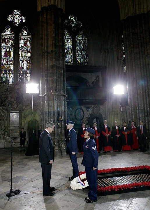 President George W. Bush bows his head in silence as a wreath is laid at the Tomb of the Unknown Warrior at Westminster Abbey in London Thursday, Nov. 20, 2003. White House photo by Eric Draper.