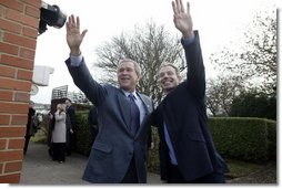 President George W. Bush and Prime Minister Tony Blair wave to onlookers during the President’s visit to the Blair’s home.  White House photo by Eric Draper