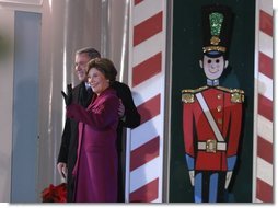 President George W. Bush and Mrs. Laura Bush arrive at the Pageant of Peace to light the National Christmas Tree at the Ellipse in Washington DC on Thursday December 4, 2003.  White House photo by Paul Morse