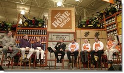 President George W. Bush participates in a conversation on the economy with employees of the Home Depot home improvement stores in Baltimore, Maryland on December 5, 2003.  White House photo by Paul Morse