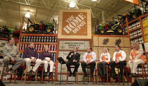 President George W. Bush participates in a conversation on the economy with employees of the Home Depot home improvement stores in Baltimore, Maryland on December 5, 2003. White House photo by Paul Morse