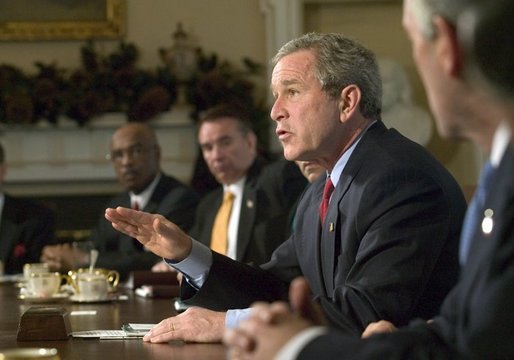 President George W. Bush speaks to reporters at the end of his Cabinet Meeting, Thursday, Dec. 11, 2003. White House photo by Eric Draper.