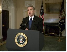 President George W. Bush addresses the nation on the capture of Saddam Hussein from the Cabinet Room, Sunday, Dec. 14, 2003.  White House photo by Eric Draper