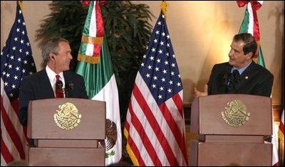 President George W. Bush and President Vicente Fox of Mexico participate in a press conference Jan. 12, 2004. "The bonds of friendship and shared values between our two nations are strong," said President Bush. "We have worked together to overcome many mutual challenges, and that work is yielding results." White House photo by Paul Morse