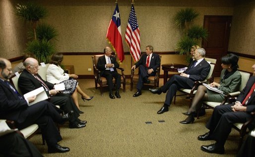 President Ricardo Lagos of Chile and President George W. Bush meet during the Special Summit of the Americas in Monterrey, Mexico, Jan. 12, 2004. White House photo by Eric Draper.