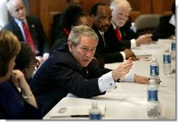 President George W. Bush holds a roundtable conversation about the positive effects that faith-based initiatives have had on local people at Union Bethel African Methodist Episcopal Church in New Orleans, La., Thursday, Jan. 15, 2004. "We just had a lot of people from the community, people who have been helped, people who are helping, neighborhood healers here to share their stories," said the President about the discussion in his remarks.  White House photo by Eric Draper